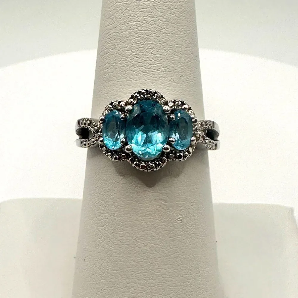 1.25ctw Swiss‎ blue topaz and genuine diamond accents in stamped .925 ring!!